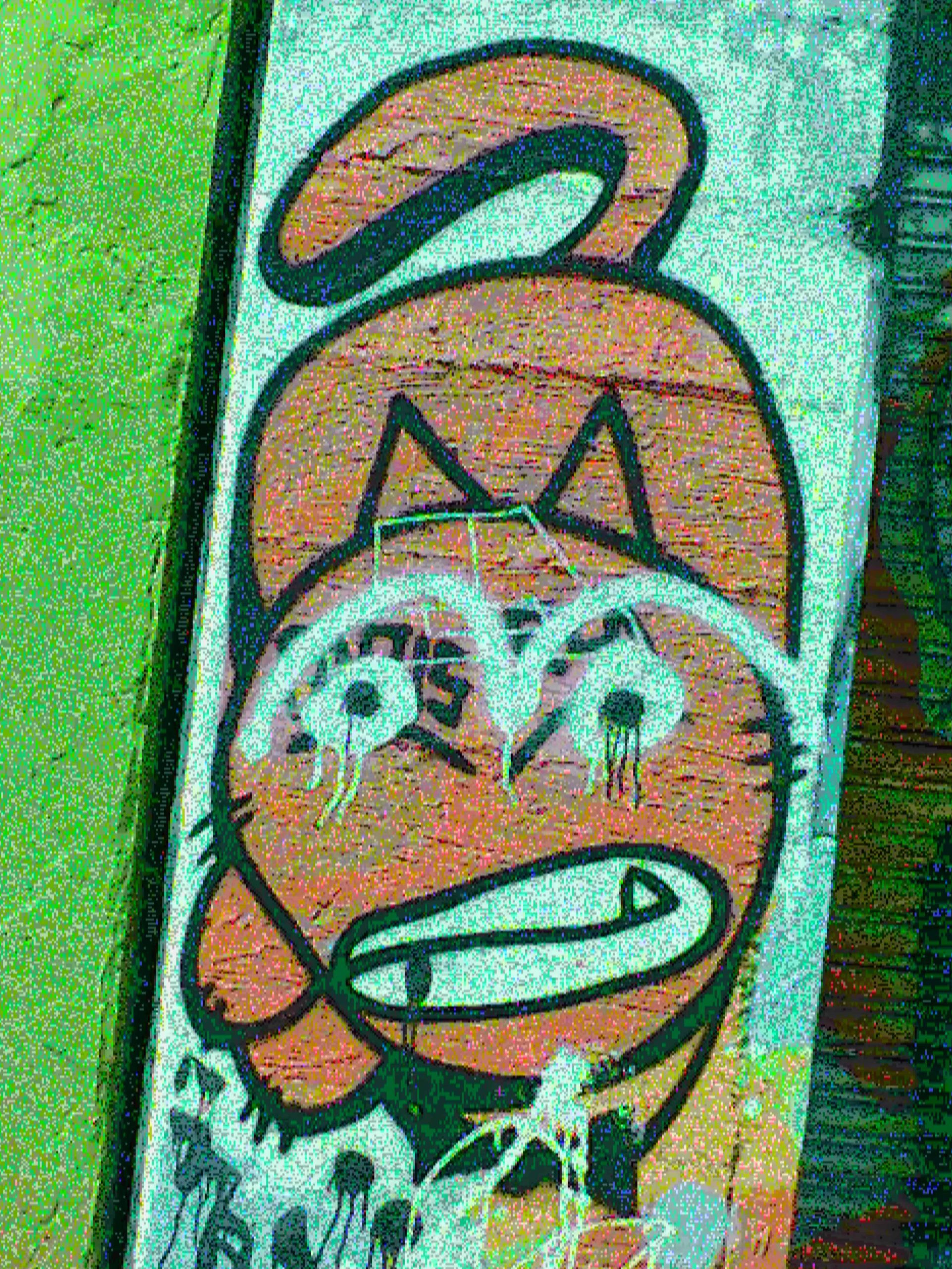 A sample glitch camera image taken of a graffiti cat - 2 of 2